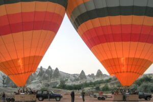 Cappadocia: Discover Sunrise on a Hot Air Balloon - The climb and the views: fairy chimneys, carved houses, and 3,000 feet of breathing room
