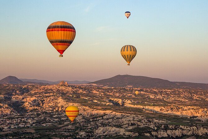 Cappadocia Hot Air Balloon Tour Over Fairychimneys - Launch-Site Breakfast: Hot Drinks, Pastry, and Dozens of Balloons Inflating