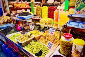 Istanbul Guided Street Food Tour Around European and Asian Sides - Misir Çarşısı area mornings: spices, dairy, and Turkish çay in tulip glasses